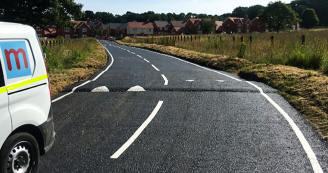 Mackoy Van Driving on New Tarmac Road by Mackoy Civil Engineering